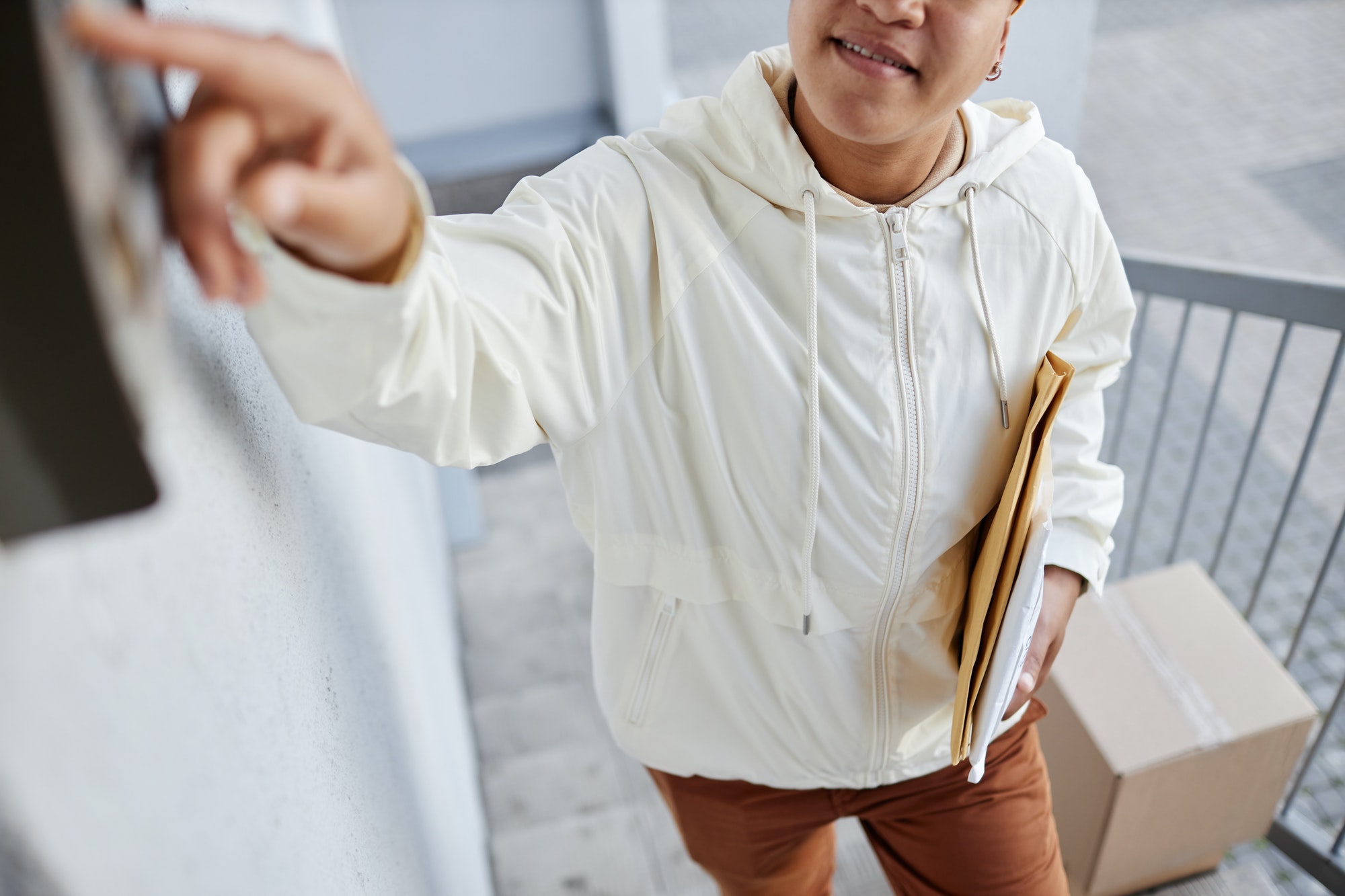 Delivery Worker Ringing Doorbell Closeup
